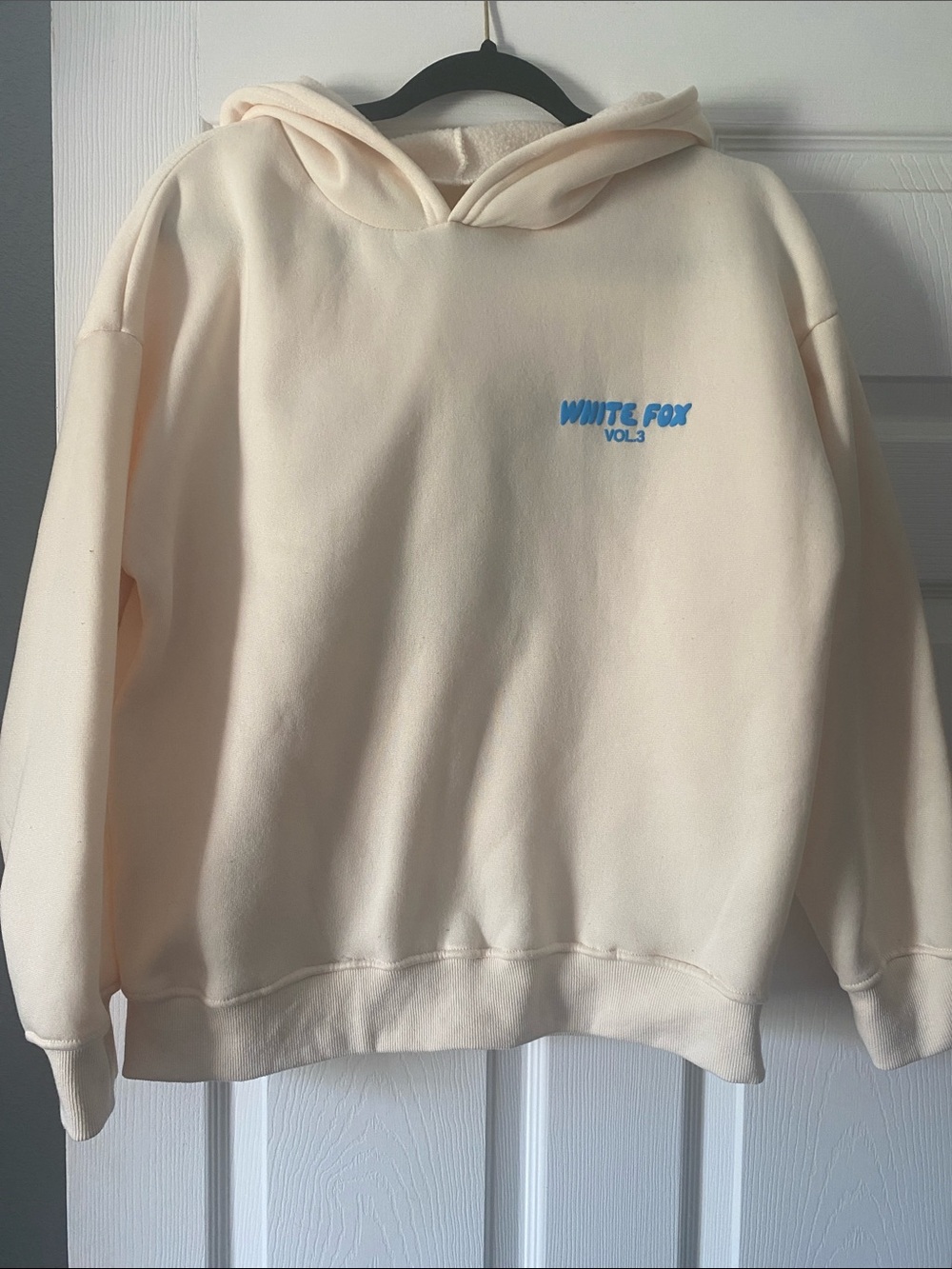 Source Unknown Cream Hoodie with Blue Logo